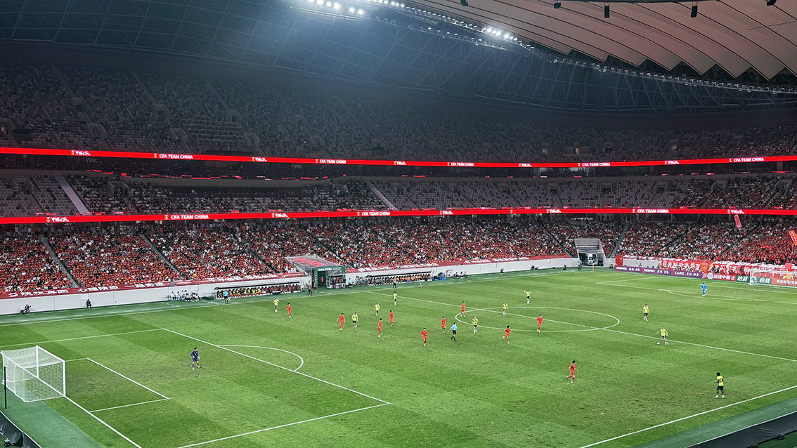Sponsor advertising rotating on the 532-metre stadium LED banner display