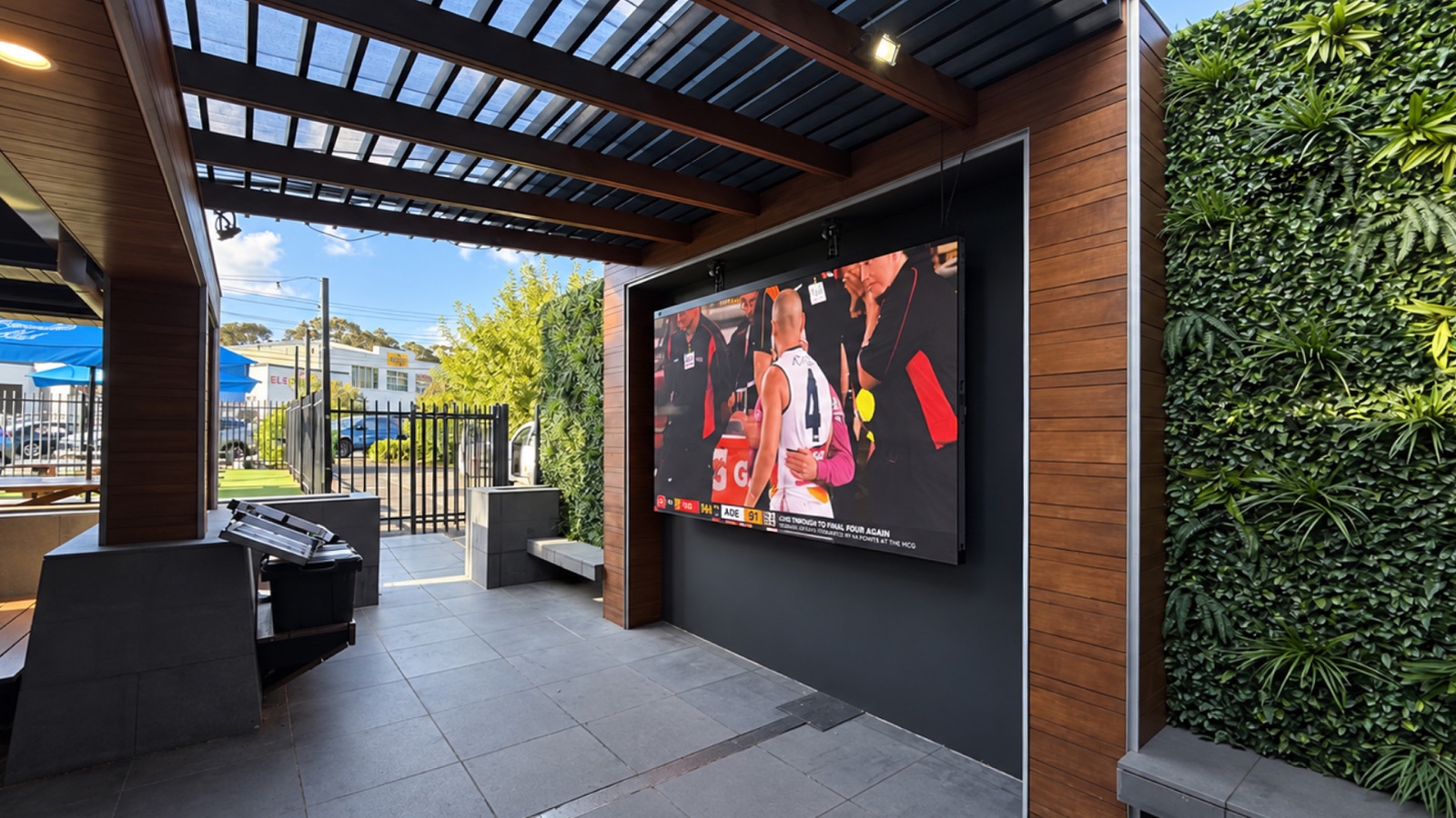 QSTECH E28 LED display showing a live sports broadcast in a Melbourne semi-outdoor bar QSTECH E28 LED display showing a live sports broadcast in a Melbourne semi-outdoor bar